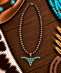 Turquoise oxen head with copper beadwork