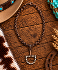 Horse bit pendant necklace in copper and white stone